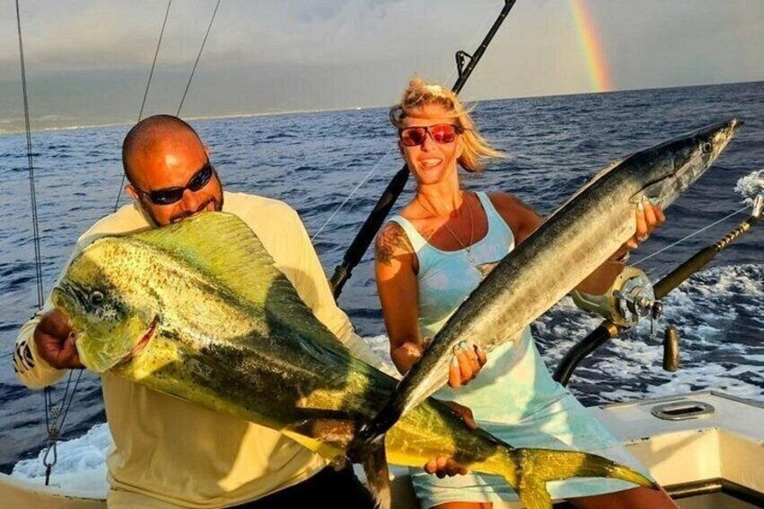 Our anglers holding up their caught Mahimahi (Dorado) and Ono (Wahoo). 5