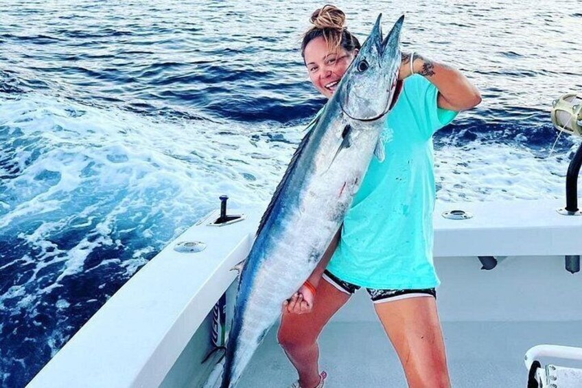 Captain Momi holding this caught Ono (Wahoo). 2