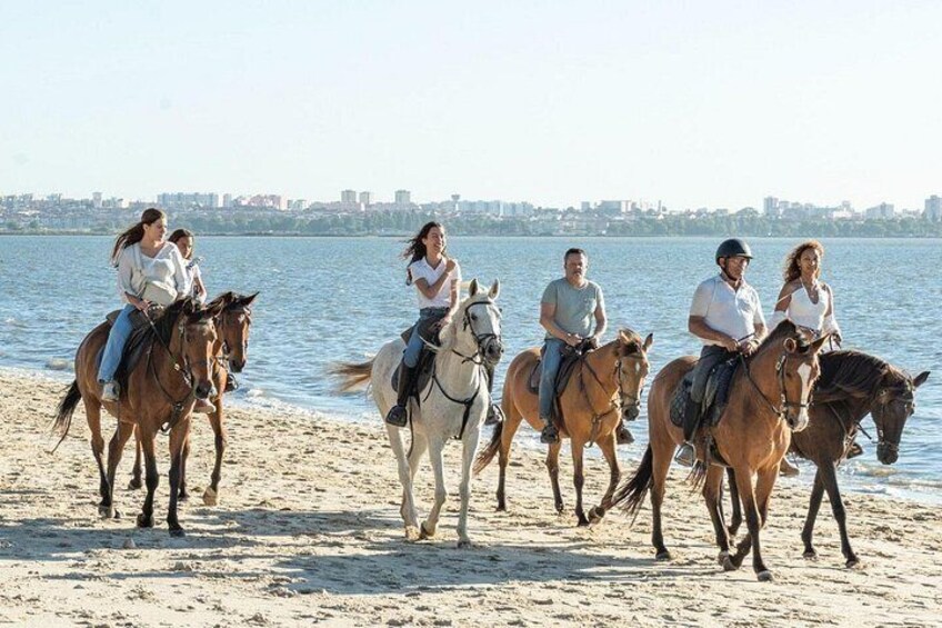 Horseback riding on the beach in group 1