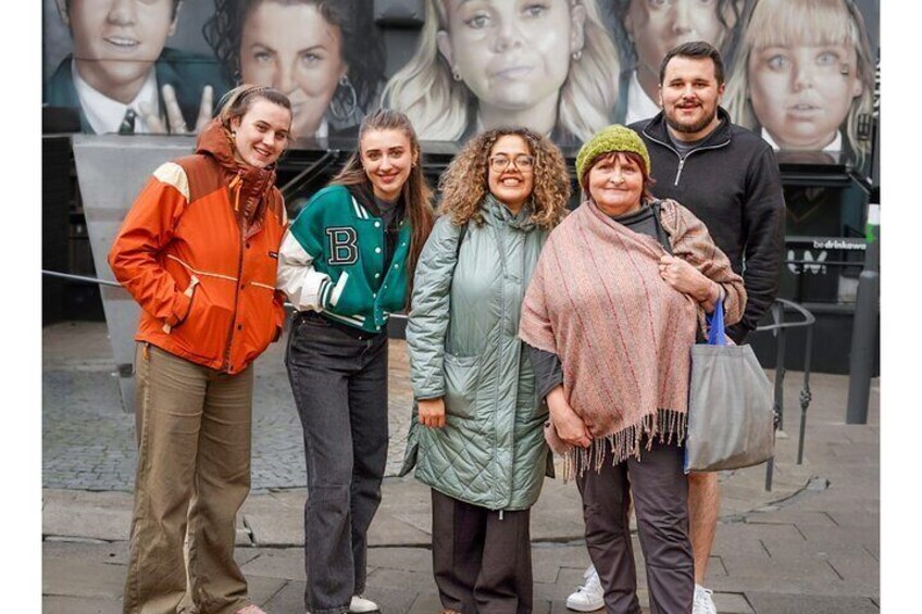 Students at the Derry Girls Mural with Guide Anne Crilly front right. 1