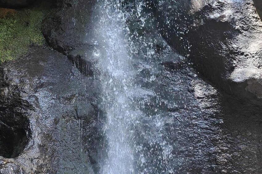 A waterfall cascading over rocks. 3