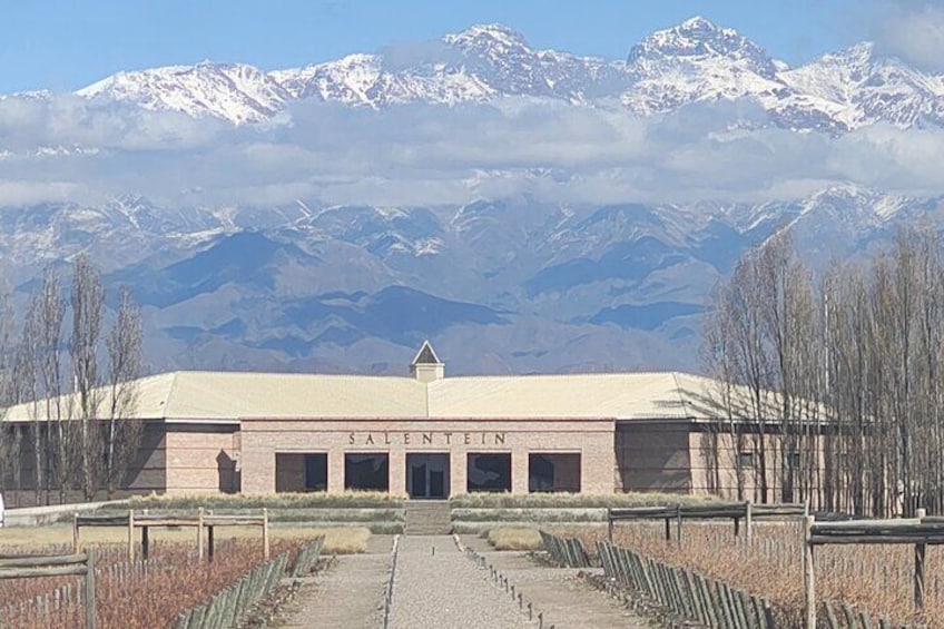 A building named SALENTIN with a mountain backdrop. 1