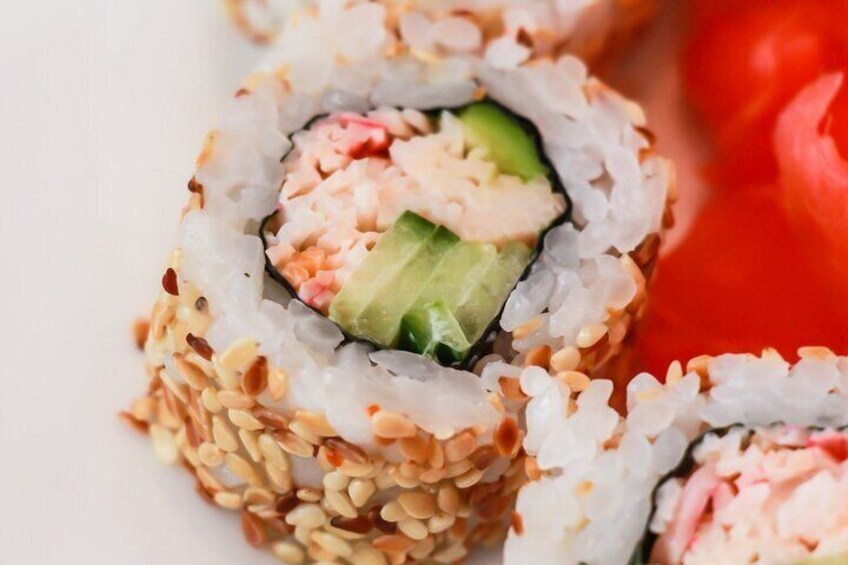 Sushi rolls with sesame seeds and avocado. 3