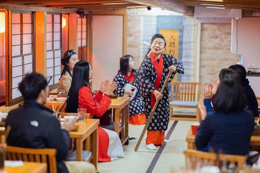 A traditional Japanese restaurant with tatami mat flooring, wooden furniture, and a shoji screen. 4