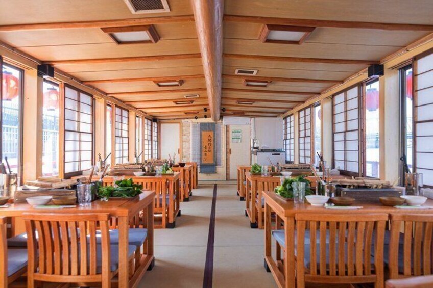 A traditional Japanese restaurant with wooden tables and tatami mats. 5