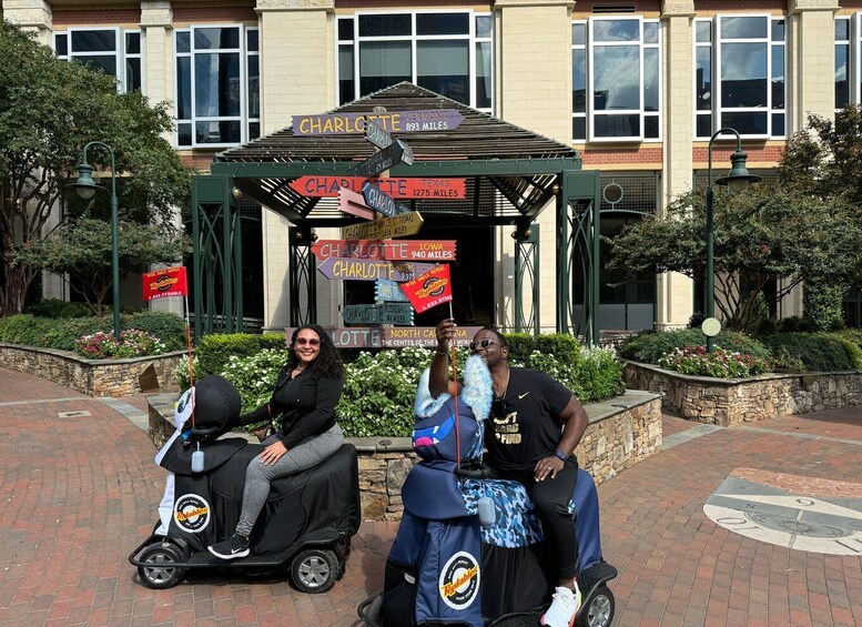 A gazebo with multiple directional signs pointing to various cities and distances. 1