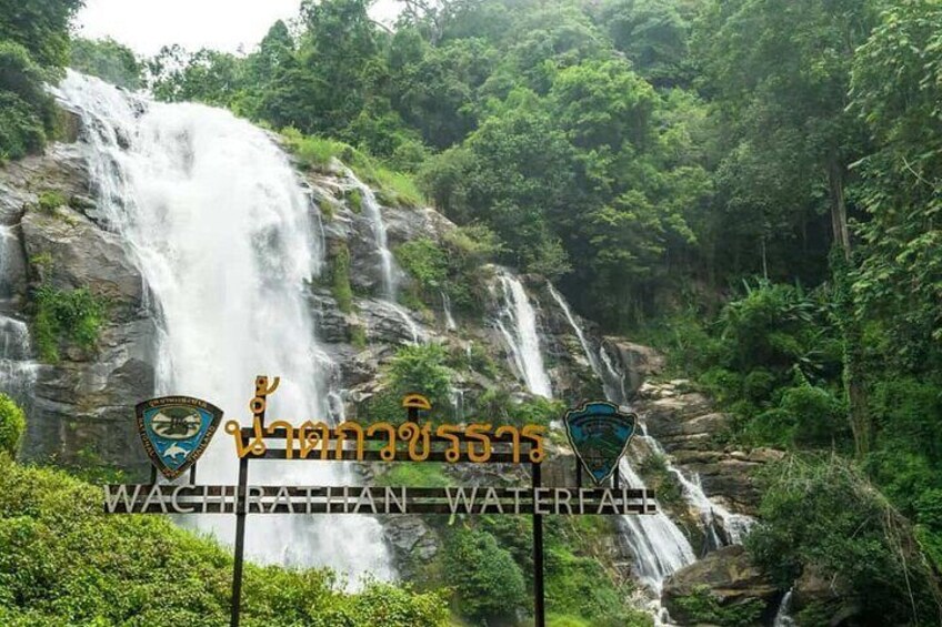 A waterfall with signs in a foreign language. 1