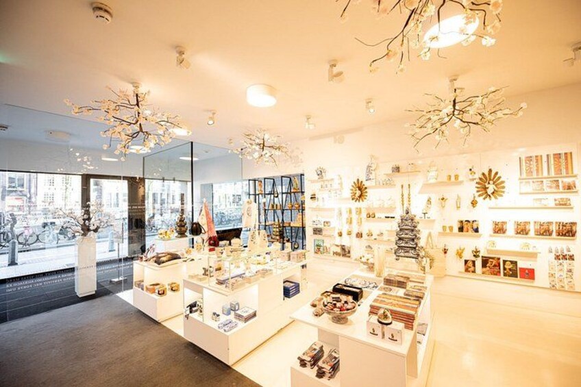 A well-lit store with various items on display, including shelves with products and decorative pieces. 4