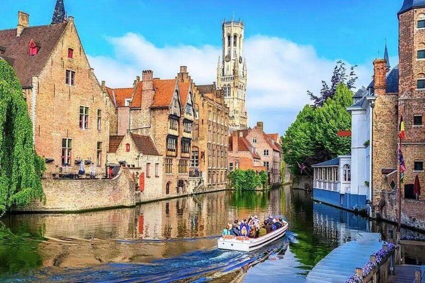 A canal with a boat, historic buildings, and a tower. 3