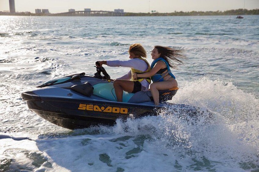Drive our brand new SeaDoo jet skies with bluetooth speakers and admire the amazing skyline of Miami 1