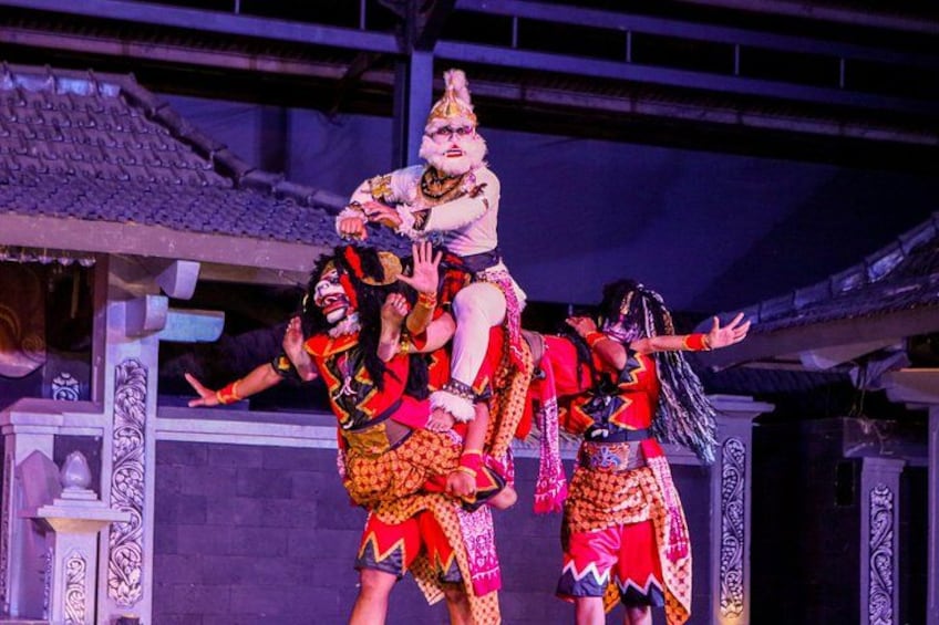 A traditional dance performance with performers in colorful costumes. 3