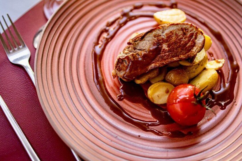Tender veal with baby potatoes and roasted tomatoes. 3