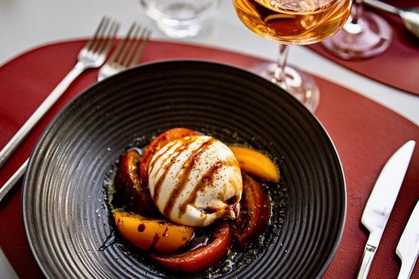 Creamy burratina with a trio of marinated tomatoes. 2