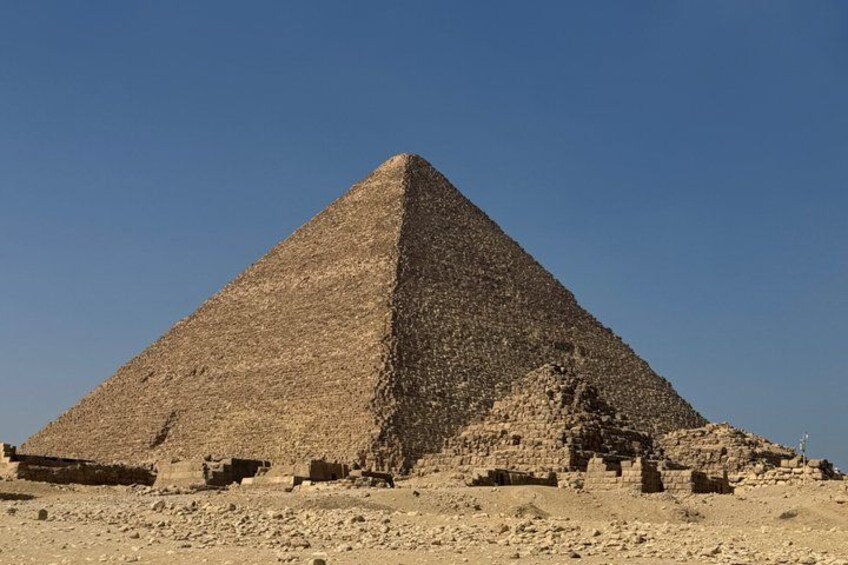 A large pyramid with a flat top, surrounded by a desert landscape. 3