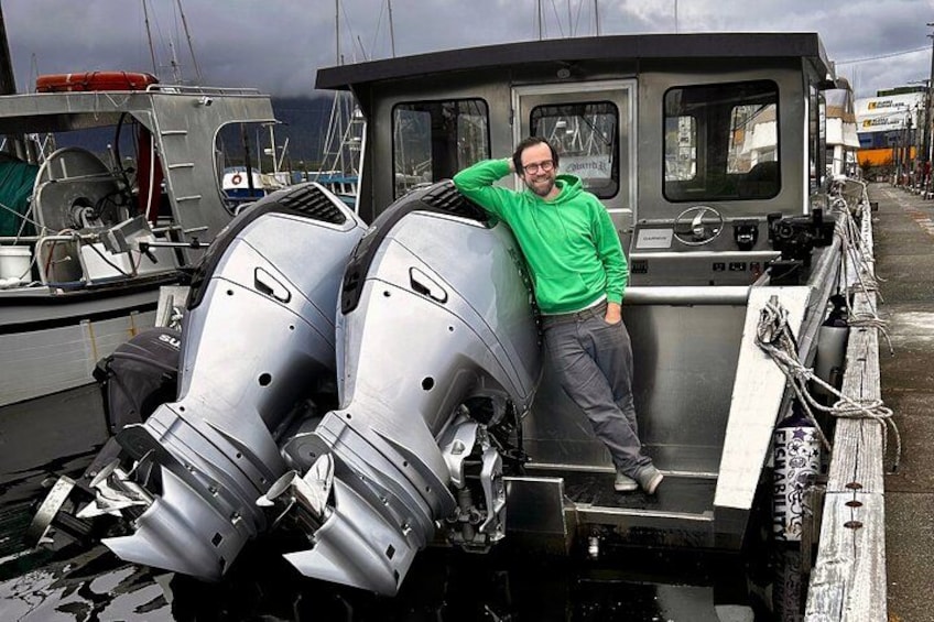 Captain Jack leans against the massive outboards that will power your adventure! 5