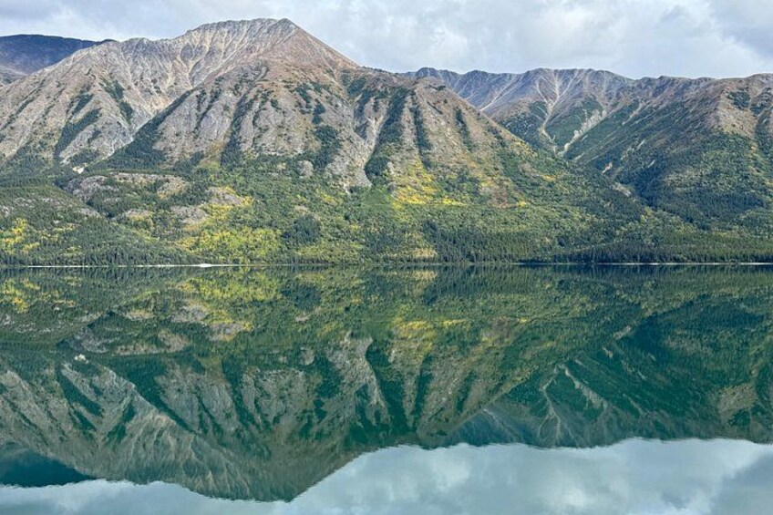 A mountain range with a lake reflecting its image. 2