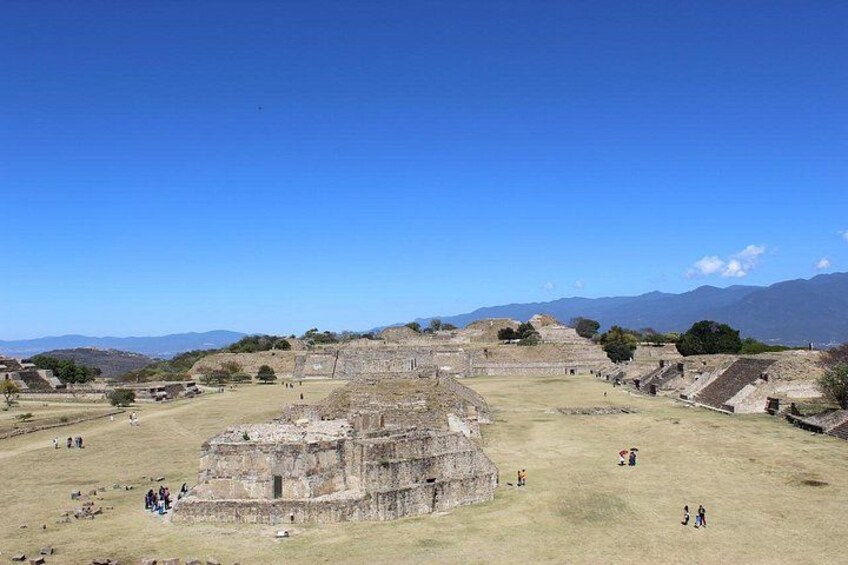 An ancient archaeological site with ruins and a clear sky. 1