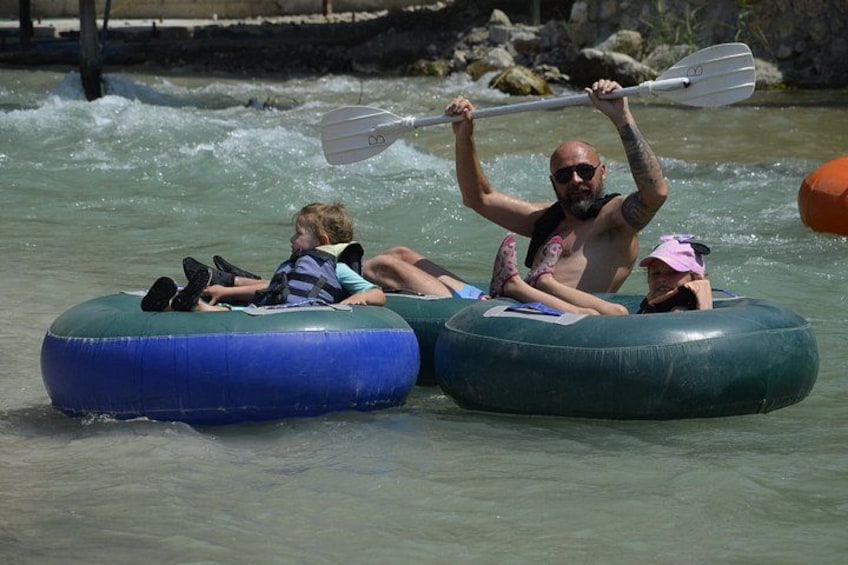 People in inflatable tubes on a river. 3