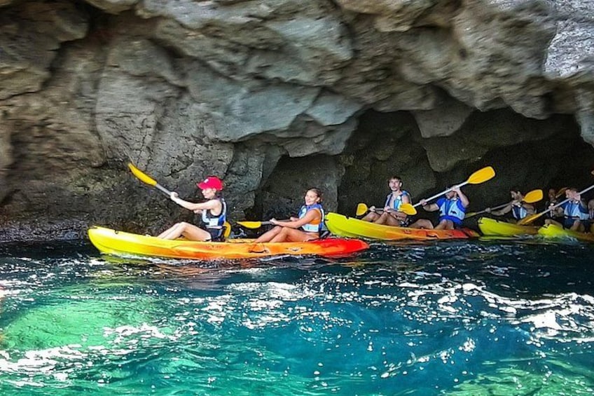 People kayaking in a cave. 2