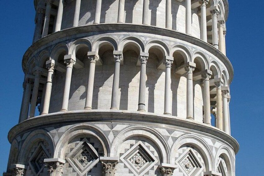 A historic tower with multiple arches and columns. 5