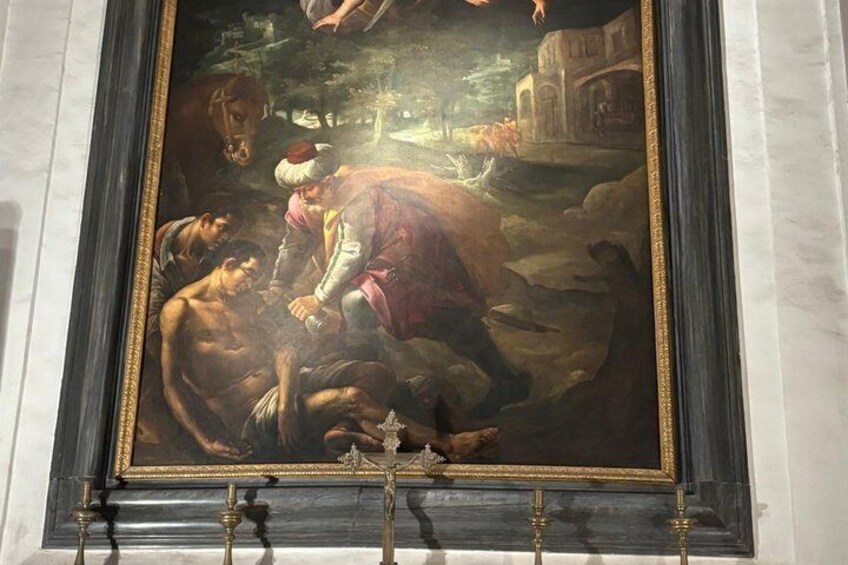A classical painting with a central figure in a red cloak, surrounded by other figures, set against a backdrop of ruins and a landscape. 4