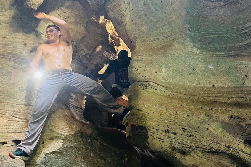 A person climbing a rock formation. 3