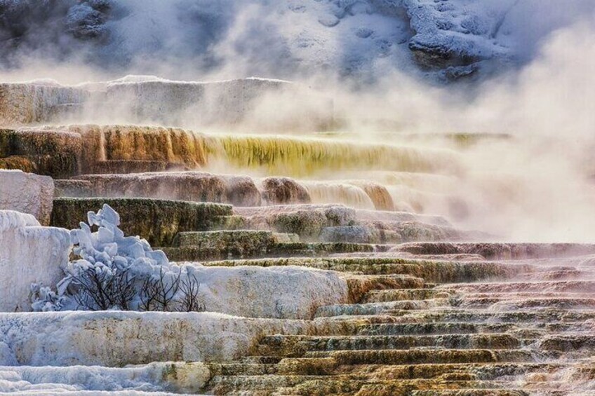 A series of terraced hot springs with steam rising from the water. 5