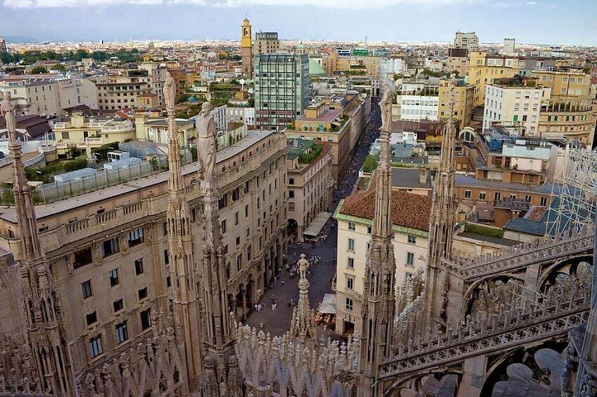 A Gothic cathedral with intricate spires and a large bridge in the background. 2