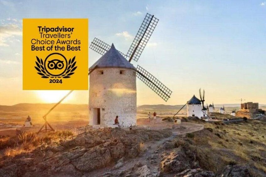 A traditional windmill, a clear sky, and a sunset. 1