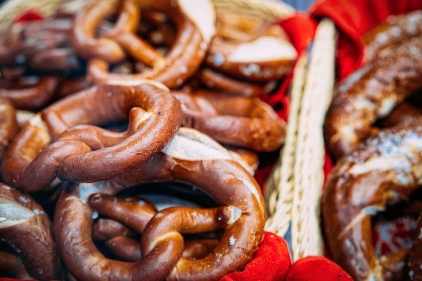 A basket of various sausages, including some that are coiled and others that are straight. 2