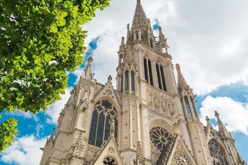 A Gothic cathedral with intricate spires and large stained glass windows. 4