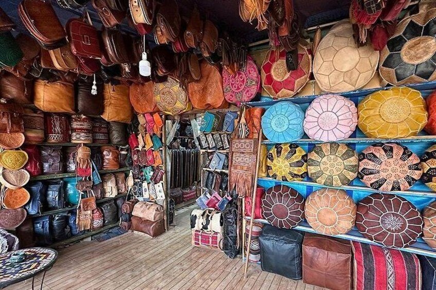 A shop with various bags and accessories on display. 4