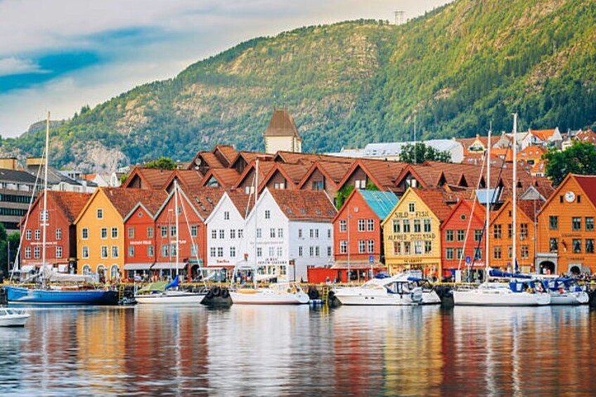 A harbor with colorful buildings and boats. 2