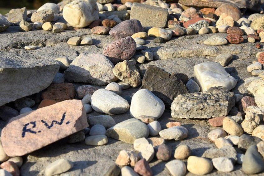 A collection of variously sized and colored rocks. 3