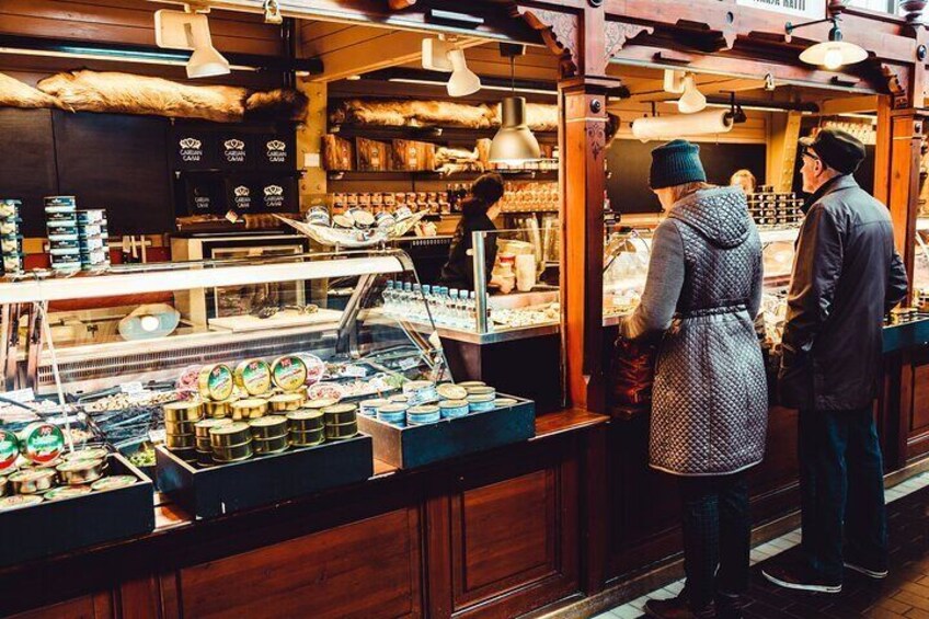 A bakery with a variety of baked goods on display. 3