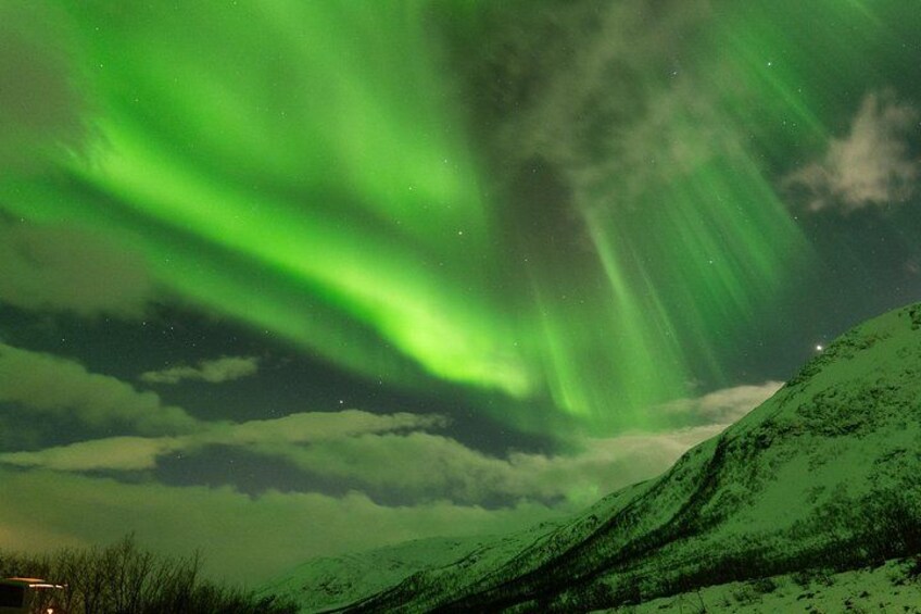 The aurora borealis over a mountainous landscape. 4