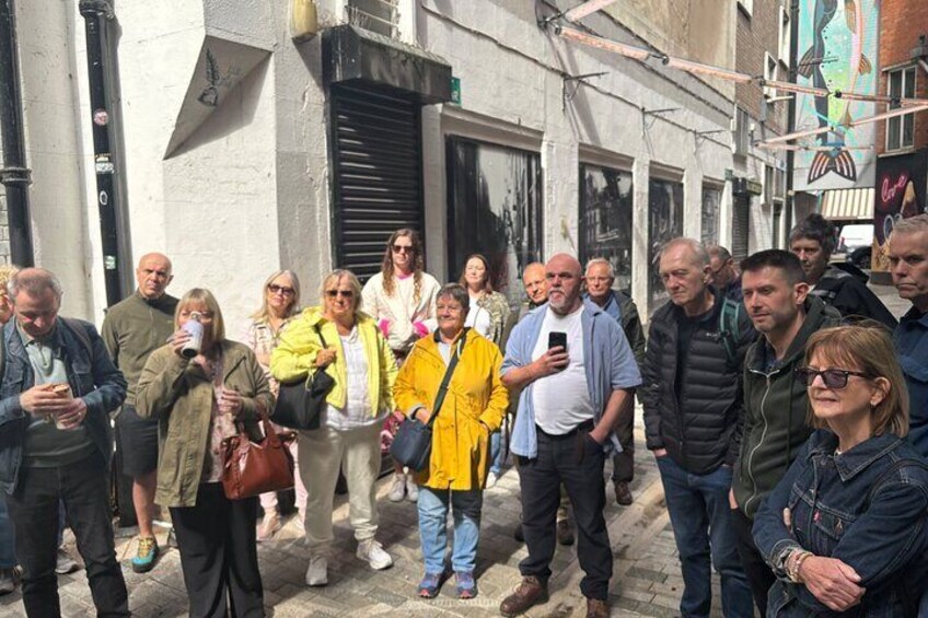 A group of people standing on a street. 3