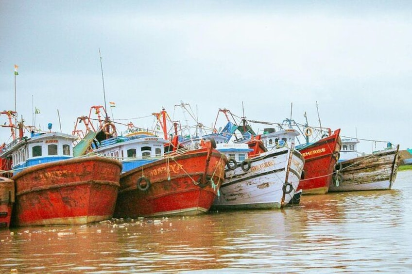 Several boats docked at a harbor. 5