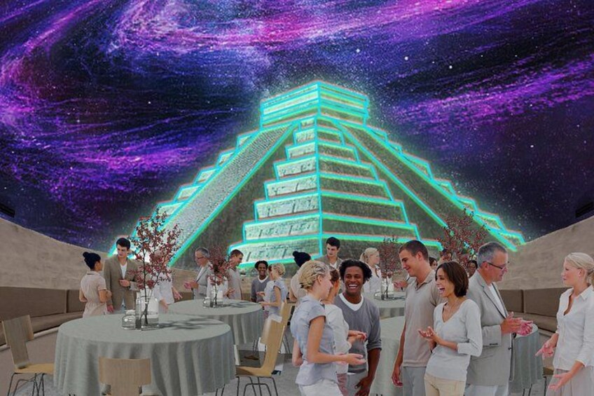 Un grupo de personas en un espacio interior moderno, con una imponente escalera iluminada al fondo. 1