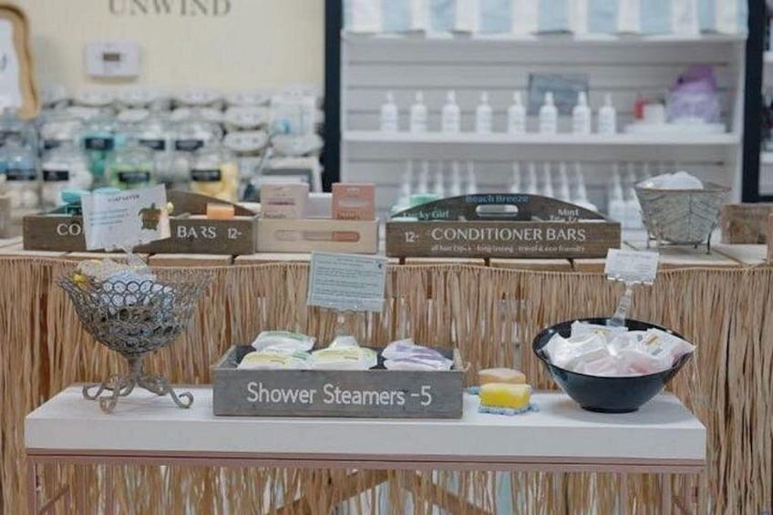 A display of shower steamers and conditioner bars in a store. 4