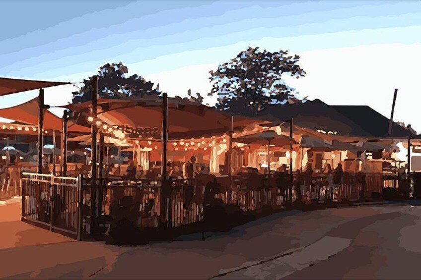 A market with stalls and a tree. 3