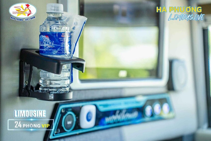 A water bottle and a cup holder on a vehicle's interior. 4