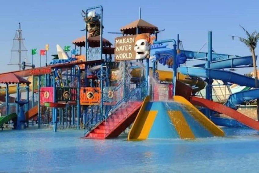 A water park with a shark tunnel and a slide. 3