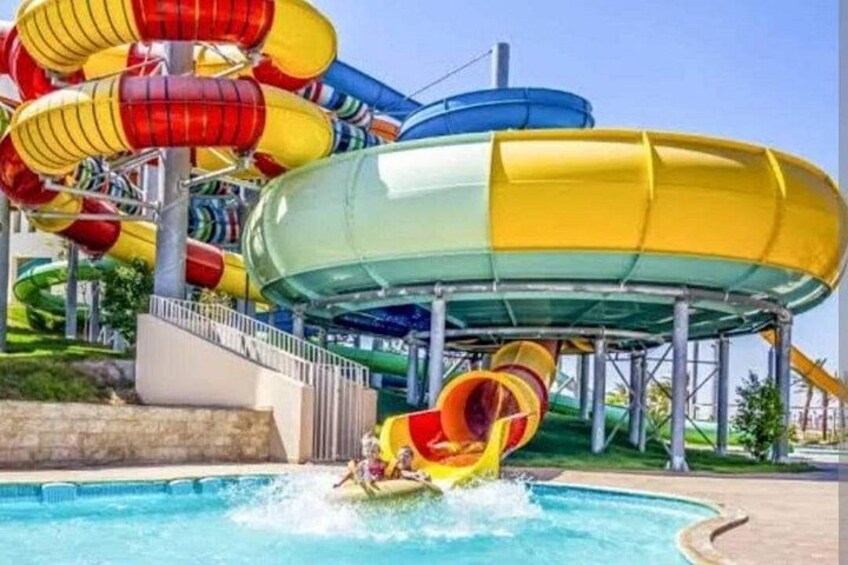 A water park with multiple water slides and a pool. 2