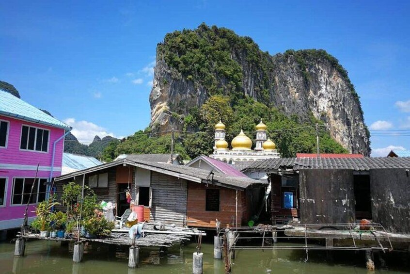 Floating houses, a cliff, and a temple with golden domes. 3