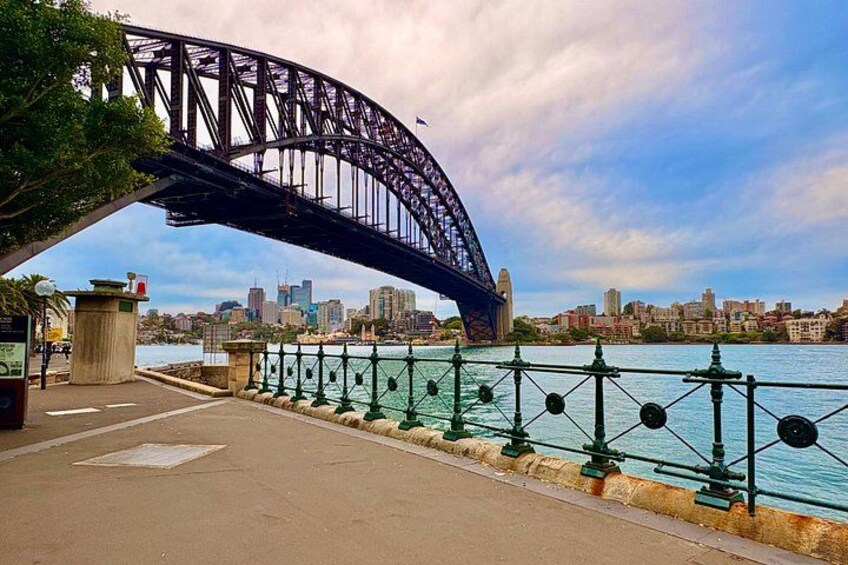 A bridge, waterfront, and city skyline. 2