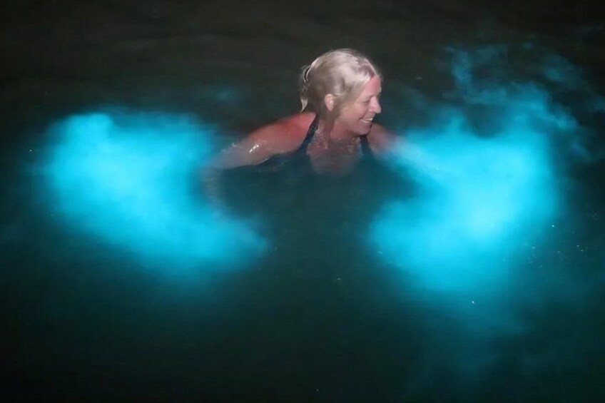 A person in water with blue light effects. 1