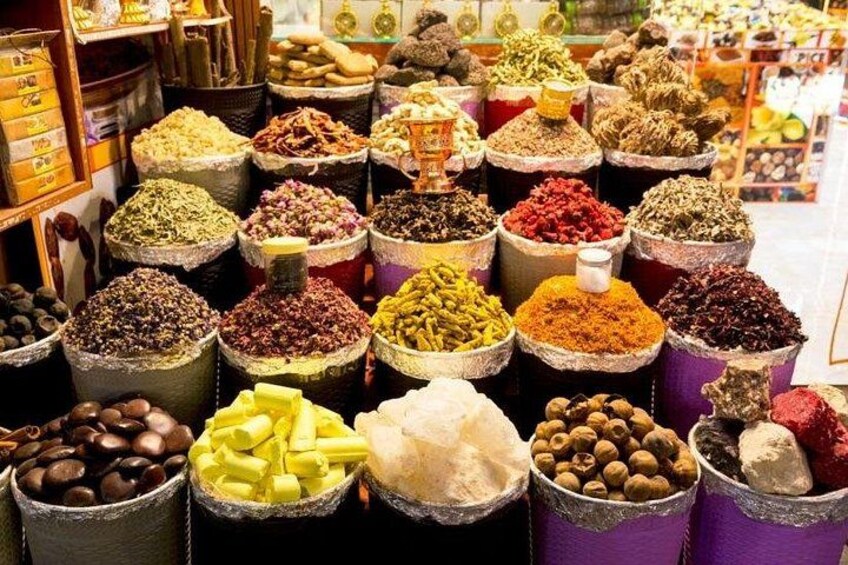 A variety of spices and herbs in containers. 2