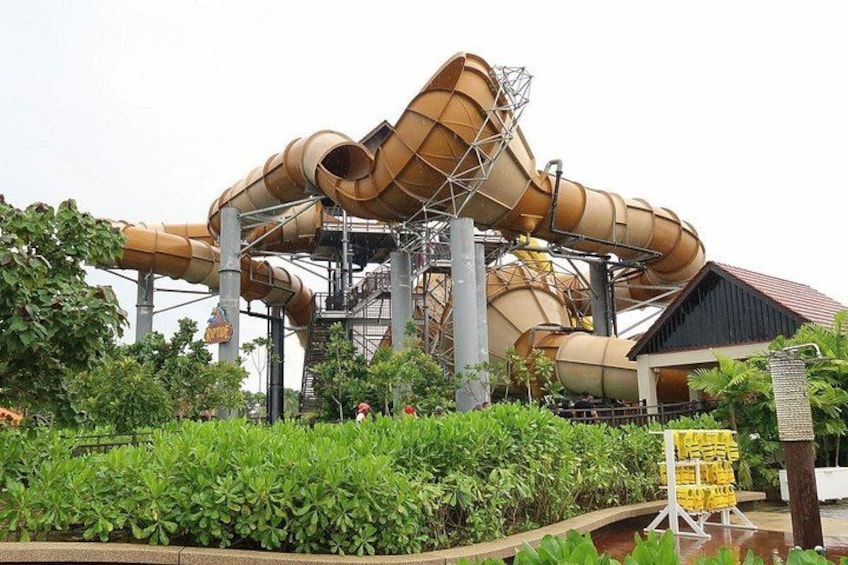 A water park with multiple slides and a building structure. 5
