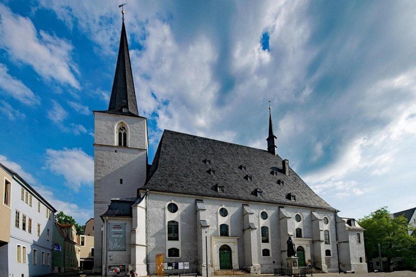 A church with a tall steeple and a clock tower. 4